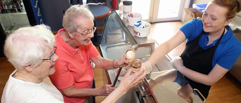 two senior women getting ice cream