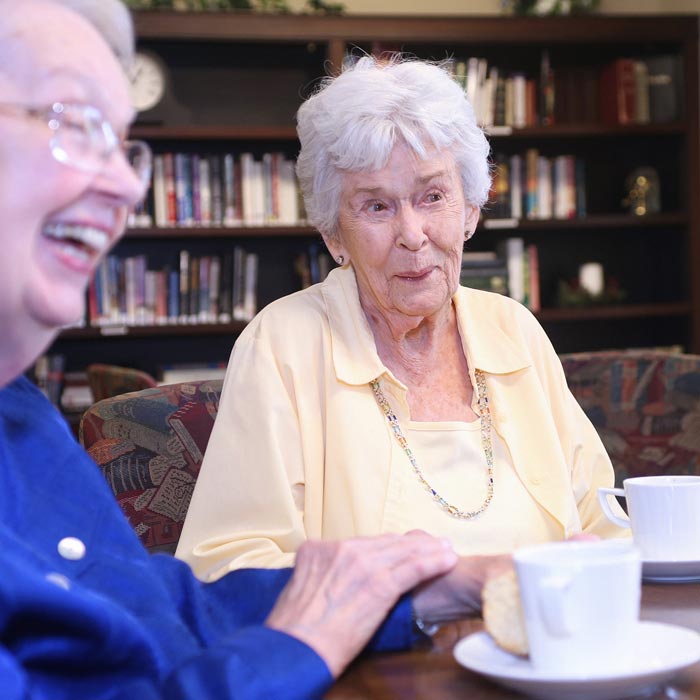 senior women having afternoon tea